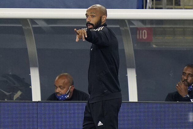Montreal Impact head coach Thierry Henry, center, shouts from the bench during the second half of an MLS soccer match against the New England Revolution, Wednesday, Sept. 23, 2020, in Foxborough, Mass. (AP Photo/Steven Senne)