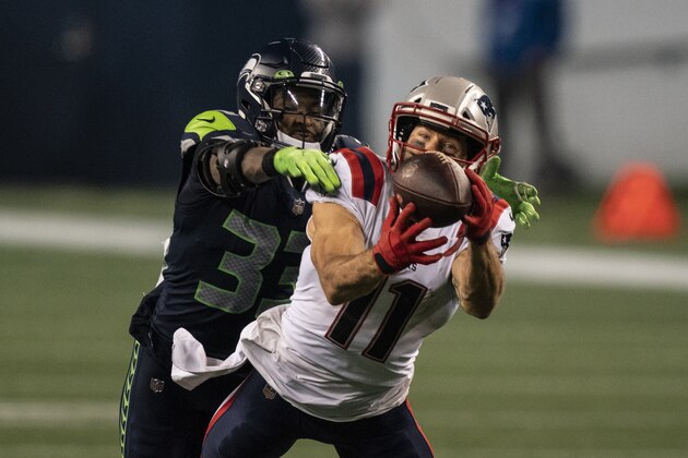 New England Patriots wide receiver Julian Edelman pulls in a reception as he is covered by Seattle Seahawks defensive back Jamal Adams during the second half of an NFL football game, Sunday, Sept. 20, 2020, in Seattle. The Seahawks won 35-30. (AP Photo/Stephen Brashear)