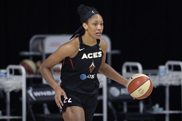 Las Vegas Aces center A'ja Wilson (22) brings the ball up the court during the first half of Game 1 of a WNBA basketball semifinal round playoff game against the Connecticut Sun, Sunday, Sept. 20, 2020, in Bradenton, Fla. (AP Photo/Phelan M. Ebenhack)
