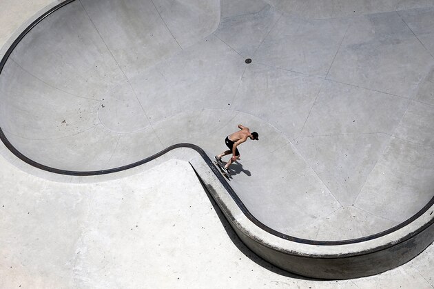 A skateboarder balances his board along a wall in a skateboard park, Thursday, June 25, 2015, in Austin, Texas. (AP Photo/Eric Gay)