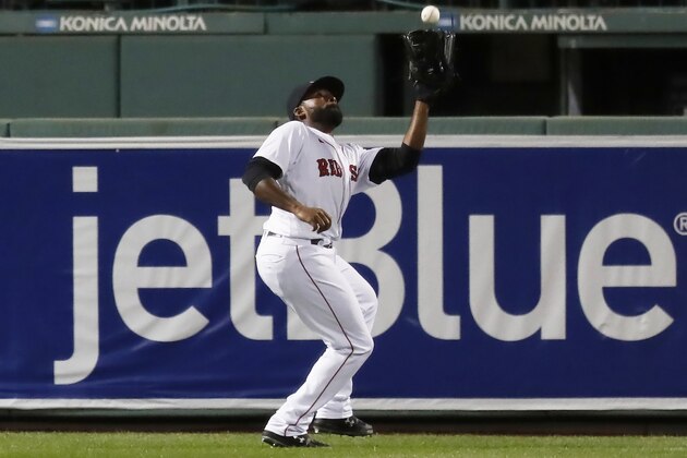 Boston Red Sox's Jackie Bradley Jr. makes the catch on a fly out by Baltimore Orioles' Ryan Mountcastle during the first inning of a baseball game Tuesday, Sept. 22, 2020, in Boston. (AP Photo/Michael Dwyer)