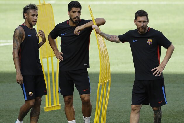 Barcelona's Neymar, left, Luis Suarez, center, and Lionel Messi look on during a training session ahead of an International Champions Cup soccer match against Juventus, Friday, July 21, 2017, in Harrison, N.J. (AP Photo/Julio Cortez)
