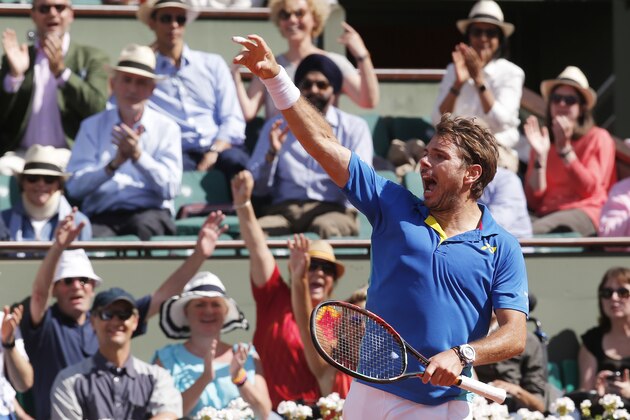 Switzerland's Stan Wawrinka reacts after winning a point as he plays Britain's Andy Murray during their semifinal match of the French Open tennis tournament at the Roland Garros stadium, Friday, June 9, 2017 in Paris. (AP Photo/Michel Euler)