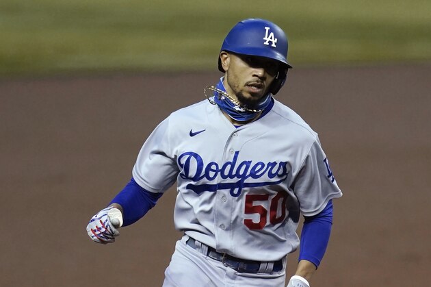 Los Angeles Dodgers' Mookie Betts rounds the bases after hitting a home run against the Arizona Diamondbacks during the first inning of a baseball game Wednesday, Sept. 9, 2020, in Phoenix. (AP Photo/Ross D. Franklin)