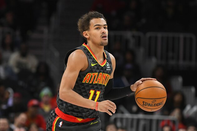 Atlanta Hawks guard Trae Young (11) dribbles upcourt during an NBA basketball game against the Charlotte Hornets, Monday, March 9, 2020, in Atlanta. (AP Photo/John Amis)