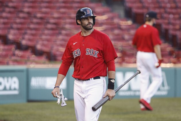 Boston Red Sox's J.D. Martinez heads for the dugout after striking out against the Toronto Blue Jays during the sixth inning of the first game of a baseball doubleheader Friday, Sept. 4, 2020, at Fenway Park in Boston. (AP Photo/Winslow Townson)