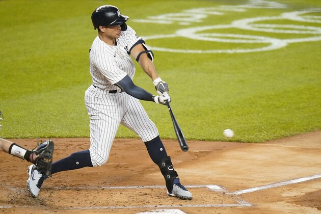 New York Yankees' Giancarlo Stanton hits a hits an RBI single during the first inning of the team's baseball game against the Toronto Blue Jays on Thursday, Sept. 17, 2020, in New York. (AP Photo/Frank Franklin II)