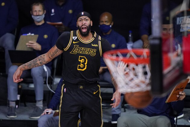 Los Angeles Lakers' Anthony Davis (3) reacts after making a 3-point basket during the second half of an NBA conference final playoff basketball game against the Denver Nuggets Sunday, Sept. 20, 2020, in Lake Buena Vista, Fla. (AP Photo/Mark J. Terrill)