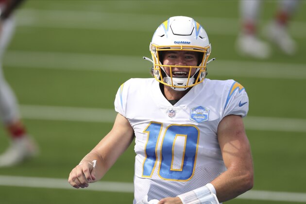 Los Angeles Chargers quarterback Justin Herbert (10) celebrates after his first career NFL touchdown pass during an NFL football game between against the Kansas City Chiefs, Sunday, Sept. 20, 2020, in Inglewood, Calif. (AP Photo/Peter Joneleit)