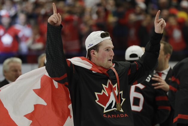 Canada's Alexis Lafreniere celebrates after winning the U20 Ice Hockey Worlds gold medal match between Canada and Russia in Ostrava, Czech Republic, Sunday, Jan. 5, 2020. (AP Photo/Petr David Josek)