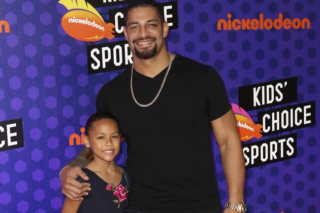 Roman Reigns, right, and Joelle Anoa'i arrives at the Kids' Choice Sports Awards at the Barker Hangar on Thursday, July 19, 2018, in Santa Monica, Calif. (Photo by Willy Sanjuan/Invision/AP)