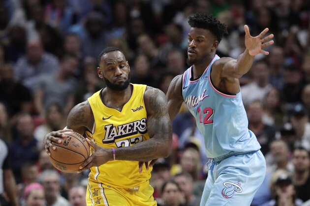 Miami Heat forward Jimmy Butler (22) defends Los Angeles Lakers forward LeBron James during the second half of an NBA basketball game, Friday, Dec. 13, 2019, in Miami. The Lakers won 113-110. (AP Photo/Lynne Sladky) Miami Heat forward Jimmy Butler (22) defends Los Angeles Lakers forward LeBron James during the second half of an NBA basketball game, Friday, Dec. 13, 2019, in Miami. The Lakers won 113-110. (AP Photo/Lynne Sladky)