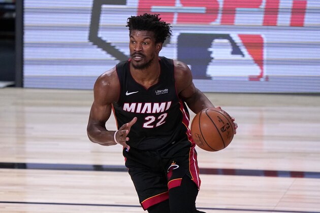 Miami Heat's Jimmy Butler (22) handles the ball during the first half of an NBA conference final playoff basketball game against the Boston Celtics on Saturday, Sept. 19, 2020, in Lake Buena Vista, Fla. (AP Photo/Mark J. Terrill)