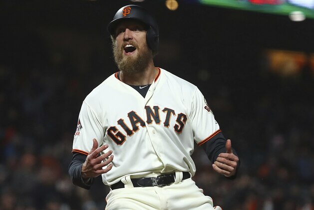 San Francisco Giants' Hunter Pence celebrates after scoring against the San Diego Padres during the seventh inning of a baseball game Tuesday, Sept. 25, 2018, in San Francisco. (AP Photo/Ben Margot) San Francisco Giants' Hunter Pence celebrates after scoring against the San Diego Padres during the seventh inning of a baseball game Tuesday, Sept. 25, 2018, in San Francisco. (AP Photo/Ben Margot)