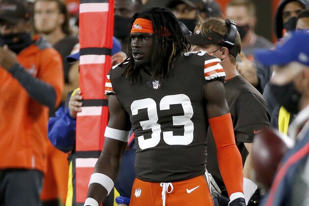 Cleveland Browns safety Ronnie Harrison (33) stands on the sideline during an NFL football game against the Cincinnati Bengals, Thursday, Sept. 17, 2020, in Cleveland. (AP Photo/Kirk Irwin)
