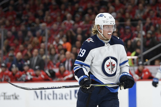 Winnipeg Jets right wing Patrik Laine (29), of Finland, stands on the ice during the first period of an NHL hockey game against the Washington Capitals, Tuesday, Feb. 25, 2020, in Washington. (AP Photo/Nick Wass)
