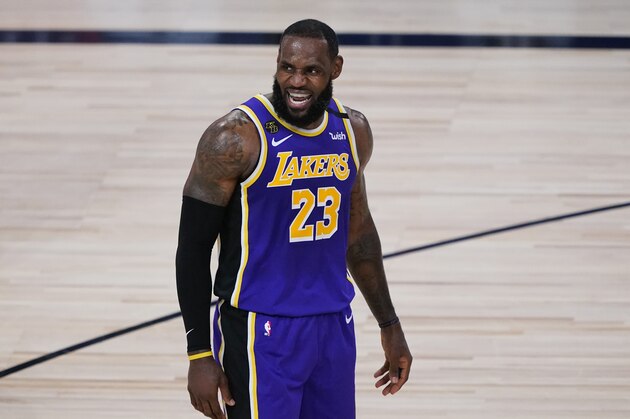 Los Angeles Lakers forward LeBron James (23) talks to teammates during the first half of an NBA basketball first round playoff game against the Portland Trail Blazers, Saturday, Aug. 22, 2020, in Lake Buena Vista, Fla. (AP Photo/Ashley Landis, Pool)