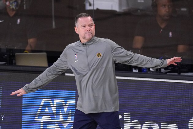 Denver Nuggets head coach Michael Malone directs his team during the second half of an NBA conference final playoff basketball game against the Los Angeles Lakers Thursday, Sept. 24, 2020, in Lake Buena Vista, Fla. (AP Photo/Mark J. Terrill)