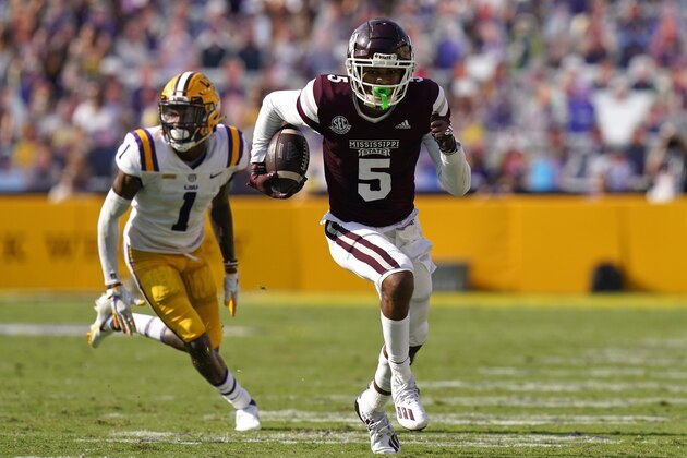 Mississippi State wide receiver Osirus Mitchell (5) carries on a touchdown reception as he is pursued by LSU cornerback Eli Ricks (1) in the first half an NCAA college football game in Baton Rouge, La., Saturday, Sept. 26, 2020. Mississippi State won 44-34. (AP Photo/Gerald Herbert) Mississippi State wide receiver Osirus Mitchell (5) carries on a touchdown reception as he is pursued by LSU cornerback Eli Ricks (1) in the first half an NCAA college football game in Baton Rouge, La., Saturday, Sept. 26, 2020. Mississippi State won 44-34. (AP Photo/Gerald Herbert)