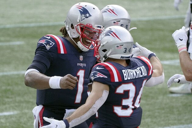 New England Patriots quarterback Cam Newton (1) celebrates his touchdown pass to running back Rex Burkhead (34) in the first half of an NFL football game against the Las Vegas Raiders, Sunday, Sept. 27, 2020, in Foxborough, Mass. (AP Photo/Charles Krupa)