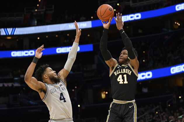 Villanova forward Saddiq Bey (41) shoots over Georgetown guard Jagan Mosely (4) during the first half of an NCAA college basketball game, Saturday, March 7, 2020, in Washington. (AP Photo/Nick Wass)