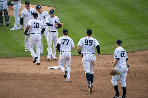 The New York Yankees celebrate their 11-4 win after a baseball game against the Miami Marlins at Yankee Stadium, Saturday, Sept. 26, 2020, in New York. (AP Photo/Corey Sipkin)