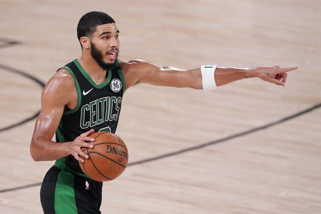 Boston Celtics' Jayson Tatum (0) directs a play during the second half of an NBA conference final playoff basketball game against the Miami Heat Friday, Sept. 25, 2020, in Lake Buena Vista, Fla. (AP Photo/Mark J. Terrill) Boston Celtics' Jayson Tatum (0) directs a play during the second half of an NBA conference final playoff basketball game against the Miami Heat Friday, Sept. 25, 2020, in Lake Buena Vista, Fla. (AP Photo/Mark J. Terrill)