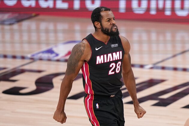 Miami Heat guard Andre Iguodala (28) celebrates after Tyler Herro (14) sunk a basket during the second half of Game 4 of an NBA basketball Eastern Conference final against the Boston Celtics on Wednesday, Sept. 23, 2020, in Lake Buena Vista, Fla. (AP Photo/Mark J. Terrill)