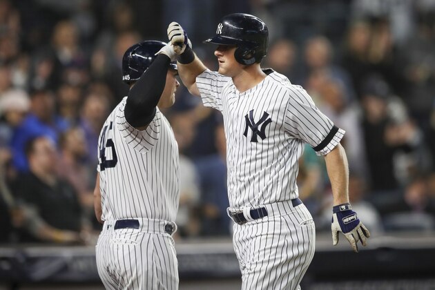 New York Yankees' DJ LeMahieu celebrates with Luke Voit after hitting a three run home run during the second inning of a baseball game against the Los Angeles Angels, Thursday, Sept. 19, 2019, in New York. (AP Photo/Mary Altaffer)