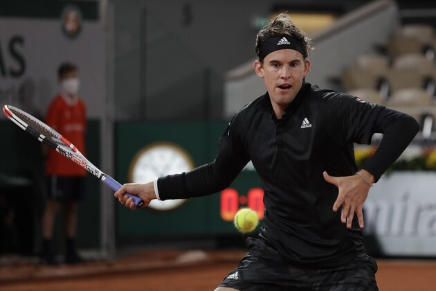 Austria's Dominic Thiem plays a shot against Croatia's Marin Cilic in the first round match of the French Open tennis tournament at the Roland Garros stadium in Paris, France, Monday, Sept. 28, 2020. (AP Photo/Alessandra Tarantino)
