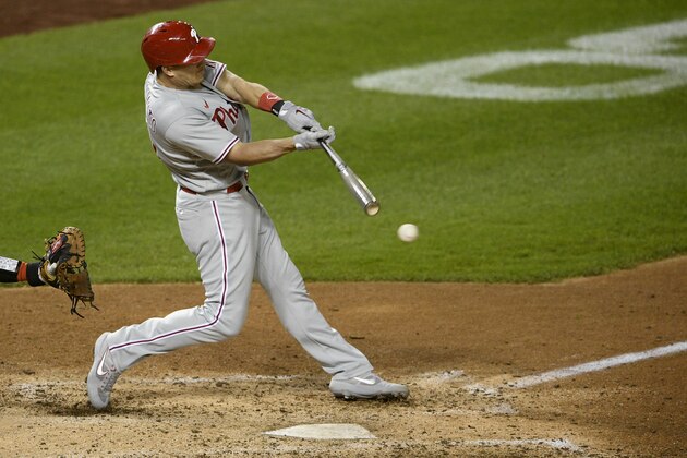 Philadelphia Phillies' J.T. Realmuto bats during the second baseball game of a doubleheader against the Washington Nationals, Tuesday, Sept. 22, 2020, in Washington. This game is a makeup from Aug. 27. The Nationals won 8-7 in extra innings. (AP Photo/Nick Wass)