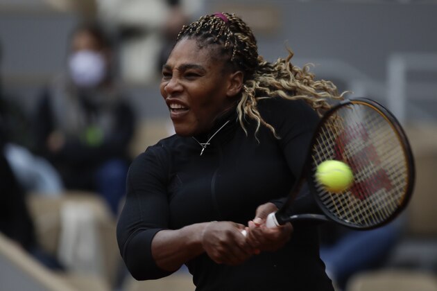 Serena Williams of the U.S. plays a shot against Kristie Ahn of the U.S. in the first round match of the French Open tennis tournament at the Roland Garros stadium in Paris, France, Monday, Sept. 28, 2020. (AP Photo/Alessandra Tarantino)
