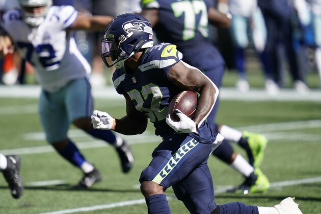 Seattle Seahawks unning back Chris Carson rushes against the Dallas Cowboys during the first half of an NFL football game, Sunday, Sept. 27, 2020, in Seattle. (AP Photo/Elaine Thompson) Seattle Seahawks unning back Chris Carson rushes against the Dallas Cowboys during the first half of an NFL football game, Sunday, Sept. 27, 2020, in Seattle. (AP Photo/Elaine Thompson)