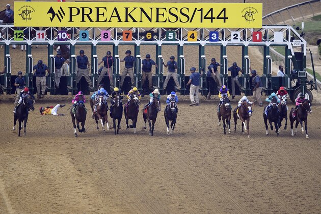 FILE - In this May 18, 2019, file photo, jockey John Velazquez tumbles to the track after falling off Bodexpress (9) as the field breaks from the starting gate in the 144th Preakness Stakes horse race at Pimlico race course in Baltimore. War of Will, far right, ridden Tyler Gaffalione won the race. A person with knowledge of negotiations tells The Associated Press the Maryland Jockey Club and NBC Sports have set aside three possible dates for the running of the next Preakness. (AP Photo/Nick Wass, File)