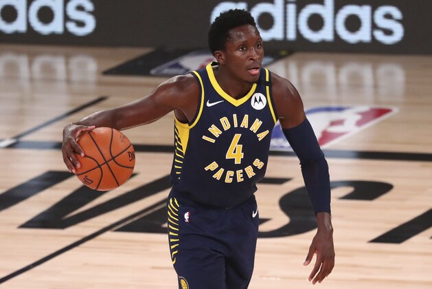Indiana Pacers guard Victor Oladipo (4) controls the ball against the Houston Rockets in the second half of an NBA basketball game Wednesday, Aug. 12, 2020, in Lake Buena Vista, Fla. (Kim Klement/Pool Photo via AP)