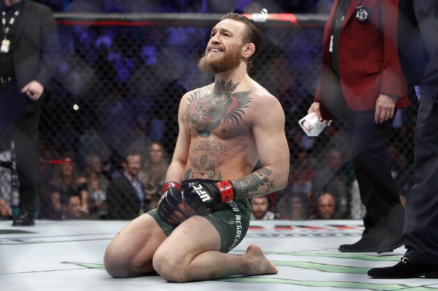 Conor McGregor smiles after defeating Donald