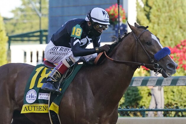 FILE - In this Saturday, Sept. 5, 2020, file photo, Authentic, ridden by jockey John Velazquez, heads to the finish line to win the 146th running of the Kentucky Derby at Churchill Downs in Louisville, Ky.  The Kentucky Derby winner is the morning line favorite at 9-5, and drew the No. 9 post in a field of 11 horses for Saturday's Preakness Stakes. (AP Photo/Darron Cummings, File)