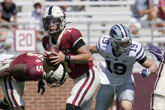 Oklahoma quarterback Spencer Rattler (7) scrambles in front of Kansas State defensive back Ross Elder (19) during an NCAA college football game Saturday, Sept. 26, 2020, in Norman, Okla. (AP Photo/Sue Ogrocki)