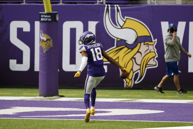 Minnesota Vikings wide receiver Justin Jefferson celebrates during a a 71-yard touchdown catch during the second half of an NFL football game against the Tennessee Titans, Sunday, Sept. 27, 2020, in Minneapolis. (AP Photo/Bruce Kluckhohn)