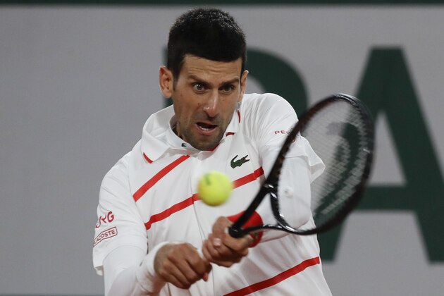 Serbia's Novak Djokovic plays a shot against Sweden's Mikael Ymer in the first round match of the French Open tennis tournament at the Roland Garros stadium in Paris, France, Tuesday, Sept. 29, 2020. (AP Photo/Alessandra Tarantino)