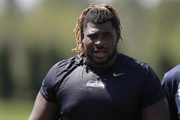Seattle Seahawks offensive guard D.J. Fluker walks on the field, Monday, July 29, 2019, during NFL football training camp in Renton, Wash. (AP Photo/Ted S. Warren)