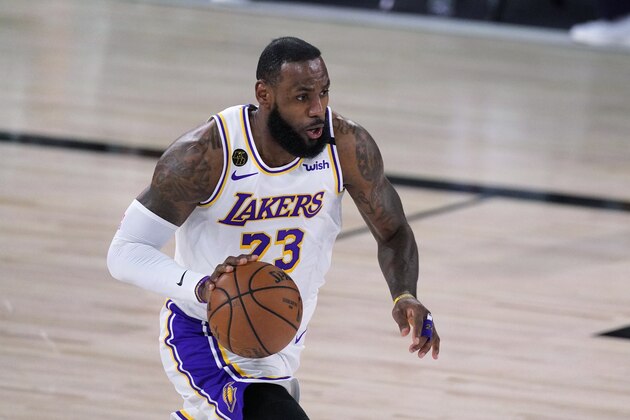 Los Angeles Lakers forward LeBron James (23) brings the ball up during the first half of Game 3 of the team's NBA basketball Western Conference final against the Denver Nuggets on Tuesday, Sept. 22, 2020, in Lake Buena Vista, Fla.(AP Photo/Mark J. Terrill) Los Angeles Lakers forward LeBron James (23) brings the ball up during the first half of Game 3 of the team's NBA basketball Western Conference final against the Denver Nuggets on Tuesday, Sept. 22, 2020, in Lake Buena Vista, Fla.(AP Photo/Mark J. Terrill)