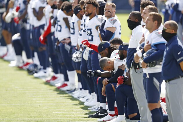 Some members of the Tennessee Titans kneel before an NFL football game between the Titans and the Jacksonville Jaguars Sunday, Sept. 20, 2020, in Nashville, Tenn. (AP Photo/Wade Payne)