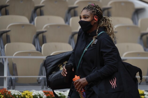 Serena Williams of the U.S. enters center court Philippe Chatrier for her first round match of the French Open tennis tournament against Kristie Ahn of the U.S. at the Roland Garros stadium in Paris, France, Monday, Sept. 28, 2020. (AP Photo/Alessandra Tarantino)