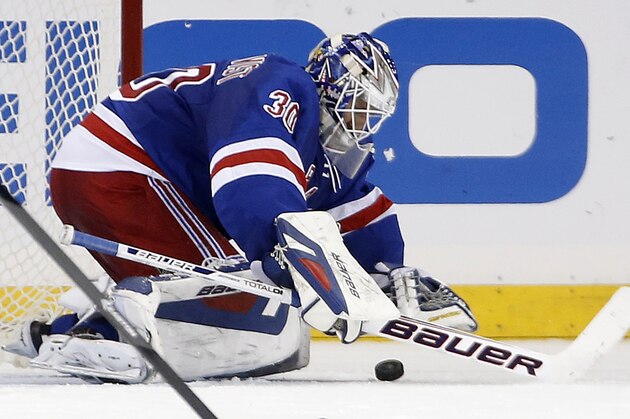 New York Rangers goalie Henrik Lundqvist (30) of Sweden makes a save in the second period of their NHL hockey game against the Washington Capitals at Madison Square Garden in New York, Sunday, Jan. 19, 2014. (AP Photo/Kathy Willens)