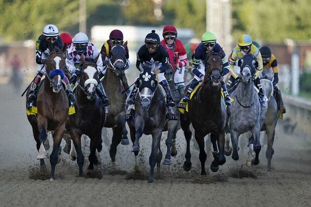 John Velazquez rides Authentic, left, as they head to turn one in the 146th running of the Kentucky Derby horse race at Churchill Downs, Saturday, Sept. 5, 2020, in Louisville, Ky. (AP Photo/Mark Humphrey) John Velazquez rides Authentic, left, as they head to turn one in the 146th running of the Kentucky Derby horse race at Churchill Downs, Saturday, Sept. 5, 2020, in Louisville, Ky. (AP Photo/Mark Humphrey)