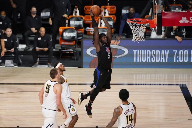 Los Angeles Clippers forward Montrezl Harrell (5) scores against the Denver Nuggets during the second half of an NBA conference semifinal playoff basketball game Tuesday, Sept. 15, 2020, in Lake Buena Vista, Fla. (AP Photo/Mark J. Terrill) Los Angeles Clippers forward Montrezl Harrell (5) scores against the Denver Nuggets during the second half of an NBA conference semifinal playoff basketball game Tuesday, Sept. 15, 2020, in Lake Buena Vista, Fla. (AP Photo/Mark J. Terrill)
