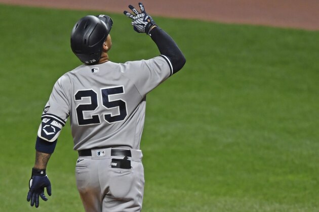 New York Yankees' Gleyber Torres (25) celebrates after hitting a two run home run in the fifth inning of Game 1 of an American League wild-card baseball series against the Cleveland Indians, Tuesday, Sept. 29, 2020, in Cleveland. (AP Photo/David Dermer)