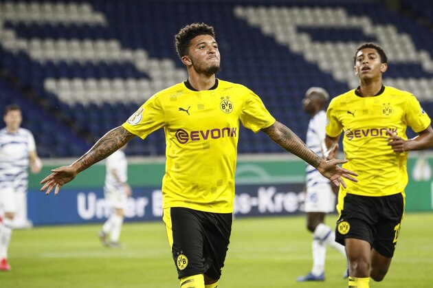 Dortmund's Jadon Sancho celebrates after scoring the opening goal with a penalty during the 1st round German Soccer Cup match between MSV Duisburg and Borussia Dortmund in Duisburg, Germany, Monday, Sept. 14, 2020. (AP Photo/Martin Meissner) Dortmund's Jadon Sancho celebrates after scoring the opening goal with a penalty during the 1st round German Soccer Cup match between MSV Duisburg and Borussia Dortmund in Duisburg, Germany, Monday, Sept. 14, 2020. (AP Photo/Martin Meissner)