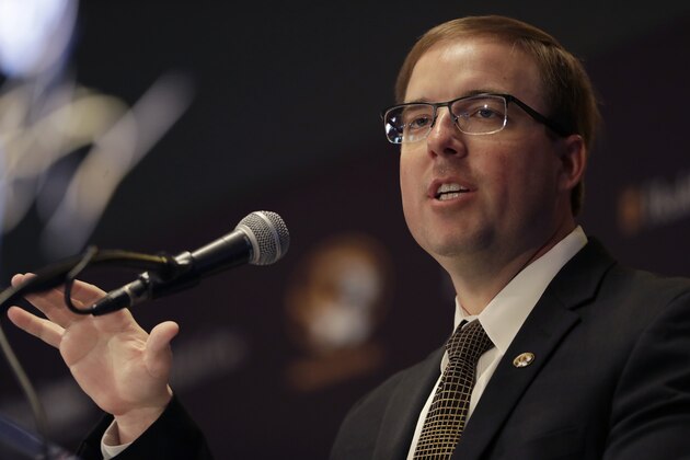 FILE - In this Dec. 10, 2019, file photo, Eliah Drinkwitz is introduced as the new head football coach at the University of Missouri, in Columbia, Mo. Last week, members of the Missouri football team marched from The Columns on campus to downtown Columbia in protest of racial injustice. The idea came from sophomore safety Martez Manuel, but it quickly gained the support of new coach Eli Drinkwitz and his staff. (AP Photo/Jeff Roberson, File) FILE - In this Dec. 10, 2019, file photo, Eliah Drinkwitz is introduced as the new head football coach at the University of Missouri, in Columbia, Mo. Last week, members of the Missouri football team marched from The Columns on campus to downtown Columbia in protest of racial injustice. The idea came from sophomore safety Martez Manuel, but it quickly gained the support of new coach Eli Drinkwitz and his staff. (AP Photo/Jeff Roberson, File)